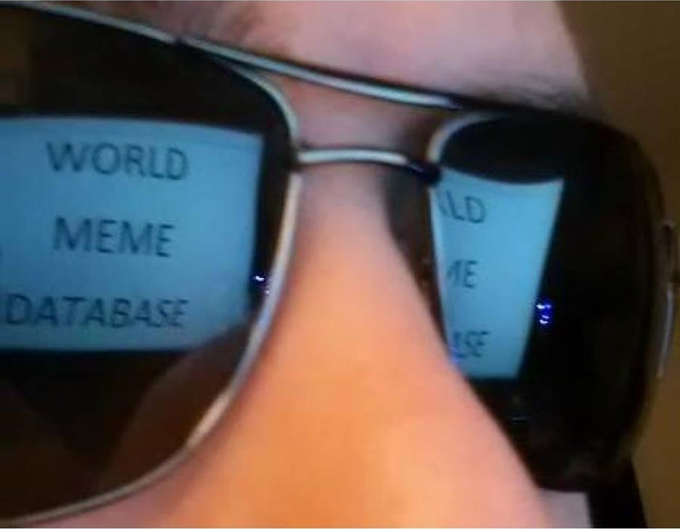 Guys i found a "certain person" secret meme stash... Should i open it? World Meme Database reflected in sunglasses looking at screen
